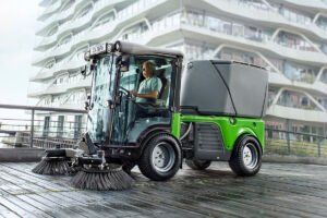 Importance of street sweepers, man riding Euromec's Powerflex street sweeper.